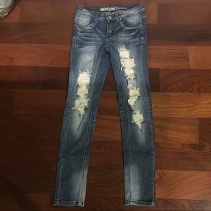Machine ripped jeans size 7